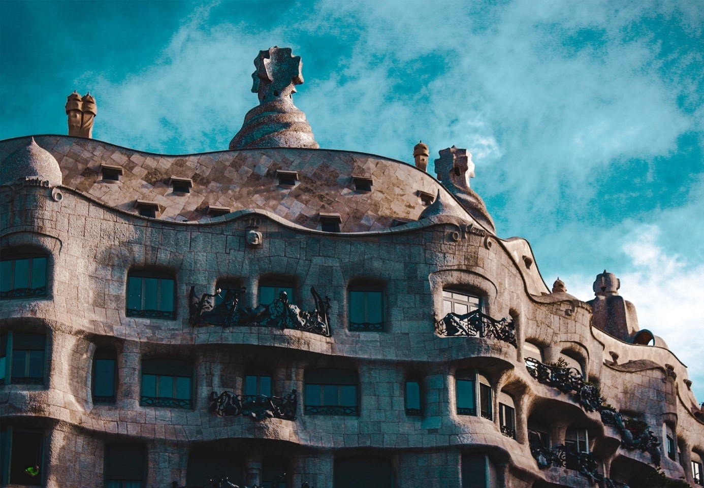 This Gaudí house got its nickname from the stonelike appearance that makes it look like a quarry