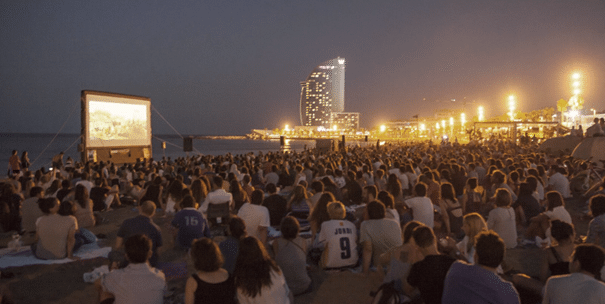 Watching a movie with friends in an open-air cinema is the perfect summer activity in Barcelona