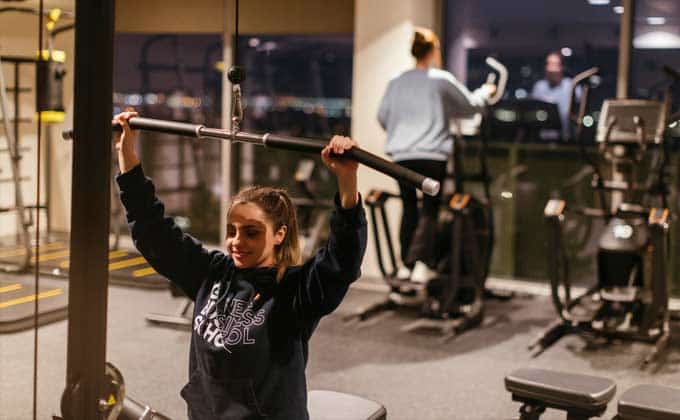 A girl training at a machine at the Livensa Living gym
