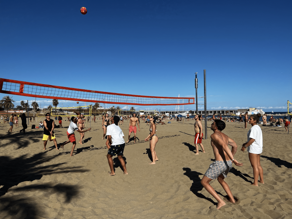 students playing beach volleyball